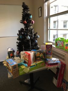 Christmas tree with toys spread out underneath it